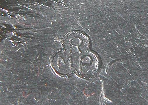 a sort of 'three-leaf clover' with the letters 'RMP' inside