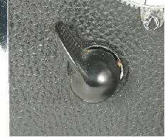 black, round knob, flat lever