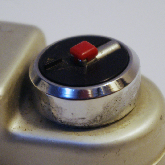 pop up crank in a raised housing